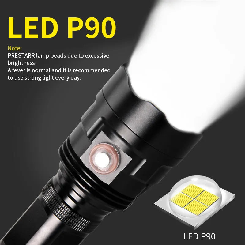 Black aluminium alloy XHP90 LED tactical flashlight showing dimensions and switch.
