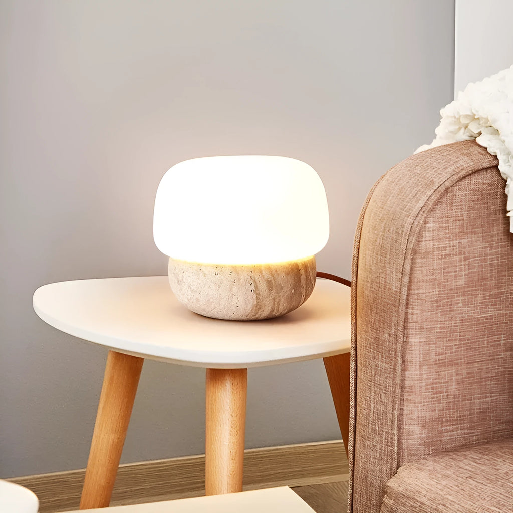 Cream-coloured retro glass bedside lamp with a button switch on its base.