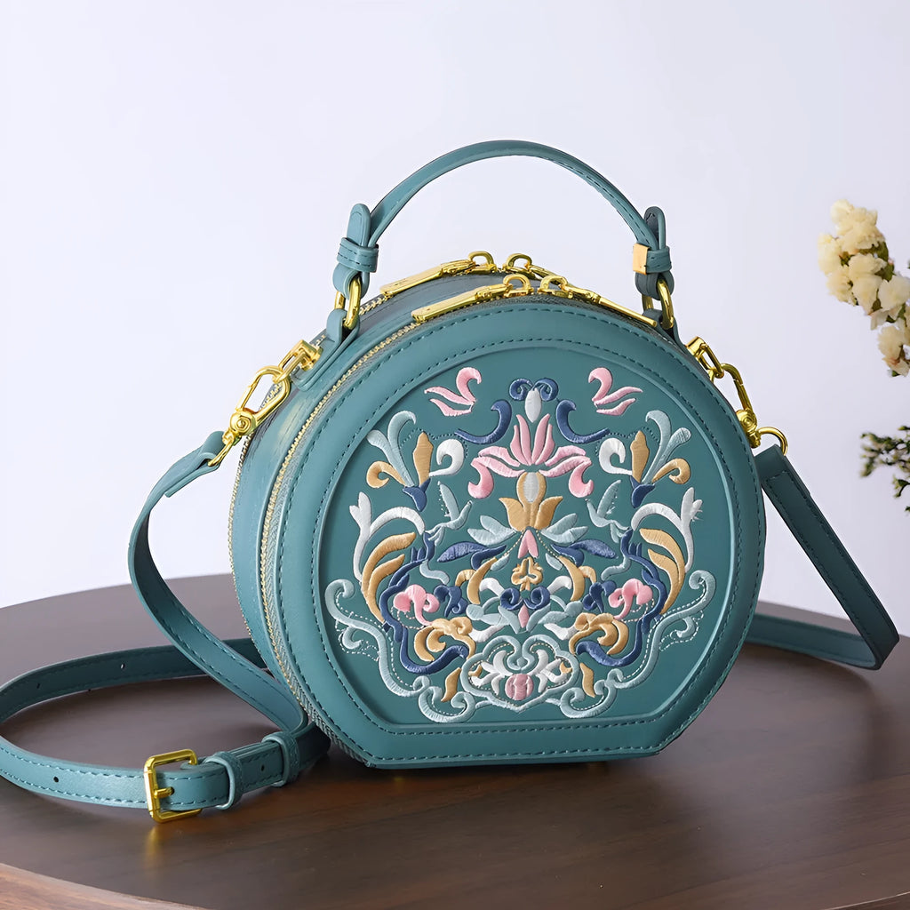 Round PU crossbody bag with embroidery, peacock blue colour, small size, front view