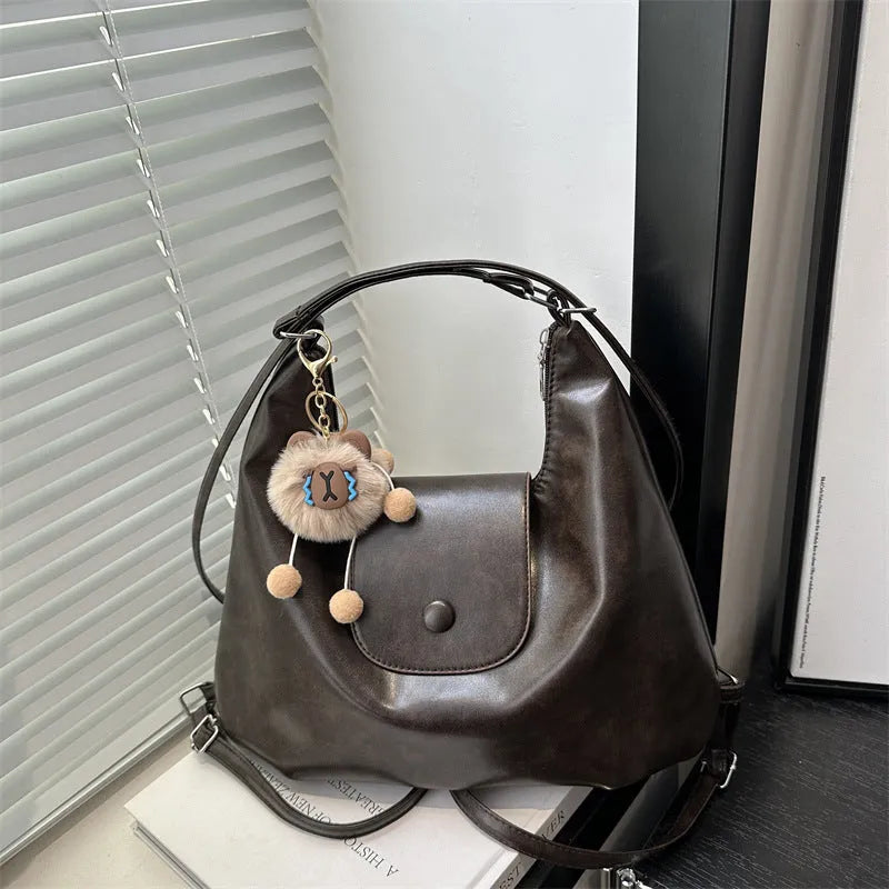 Large capacity PU leather single shoulder bag in black with internal mobile phone pocket