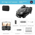 Four-axis toy drone in black with camera, under 30cm, on grey background