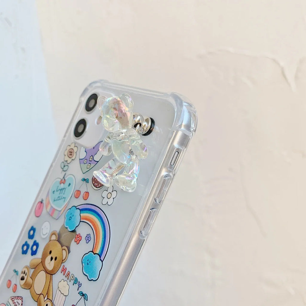 Transparent TPU iPhone case with bear chain and pendant attachment showing phone protection
