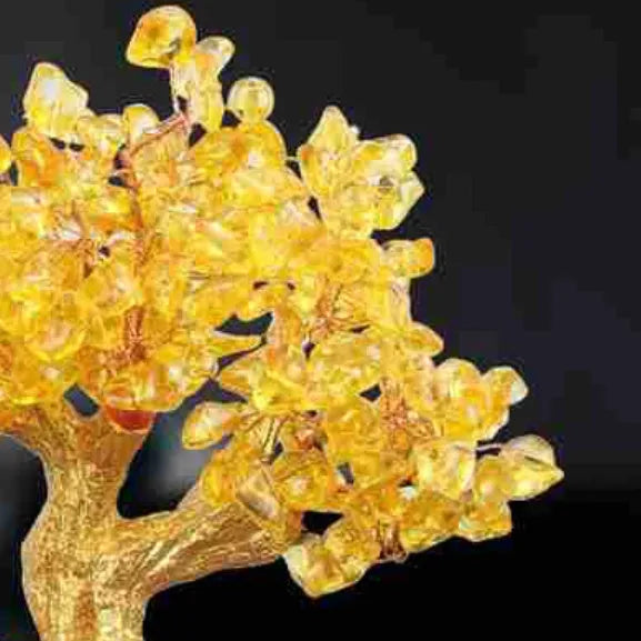 Citrine resin turtle money tree Feng Shui ornament on a white background.
