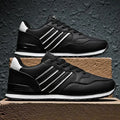 Men's black casual running shoes with white carved wing pattern on the side and a high heel.