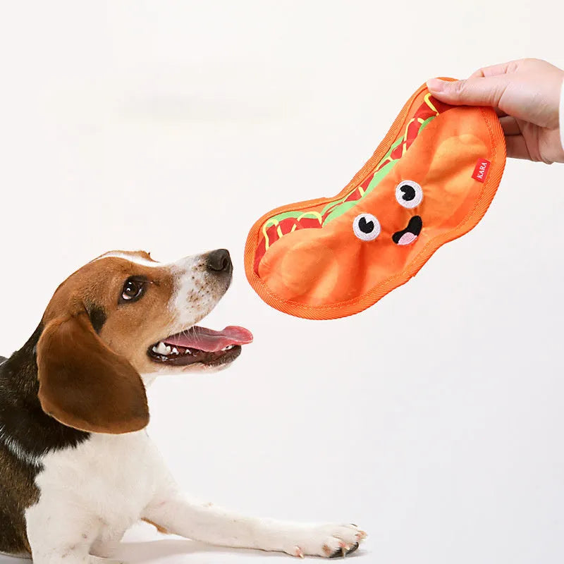 Food-shaped dog toys including hamburger, fries, hot dog and pizza designs with crinkle and squeak features