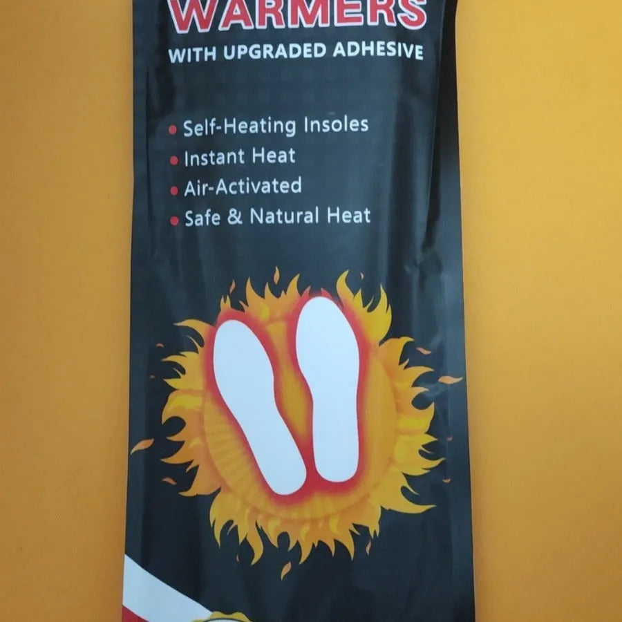 Self-heating foot warmer insoles in two sizes, walkable and battery-free, placed inside a pair of boots