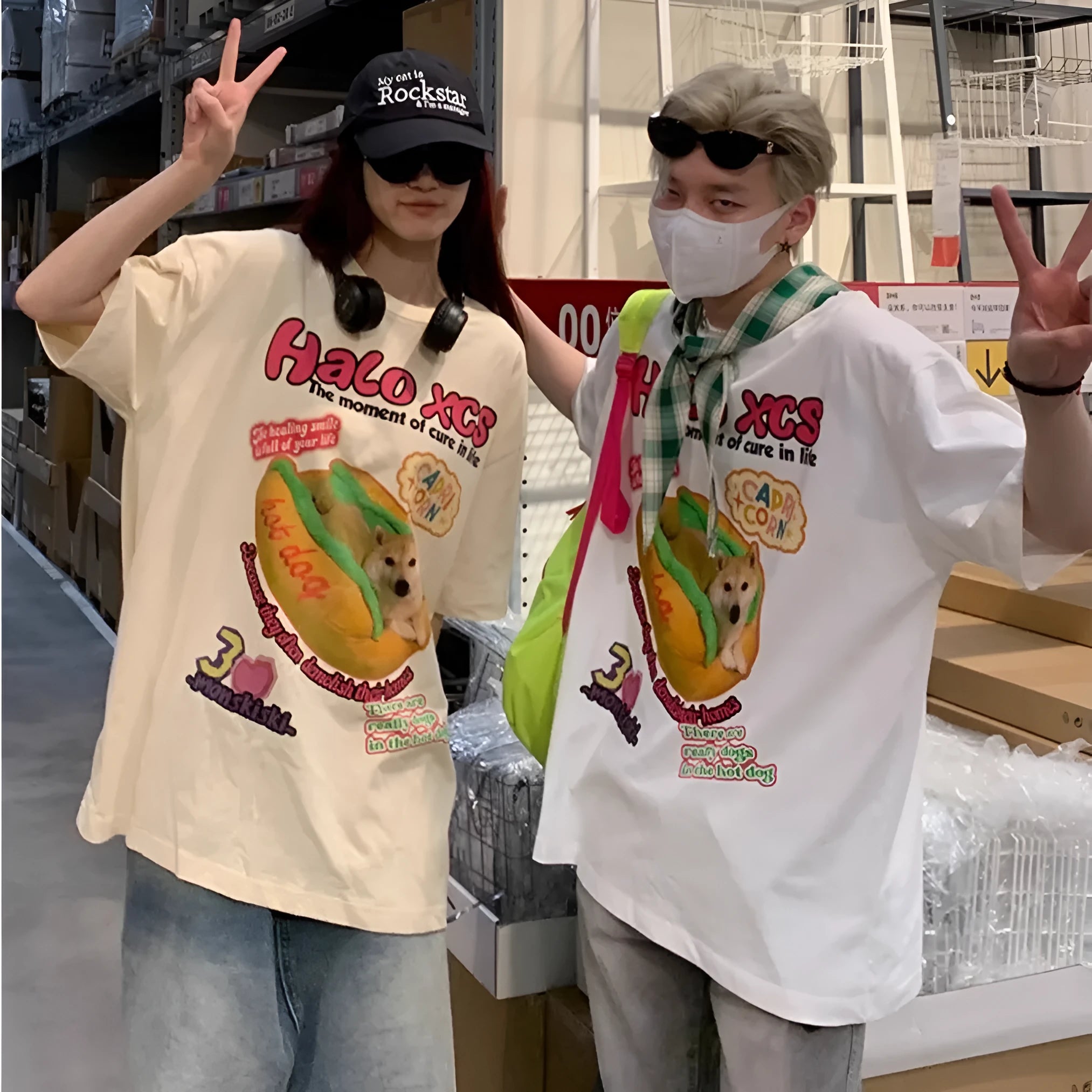 Cartoon hamburger dog print on a short-sleeved, loose-fit cotton T-shirt in white.