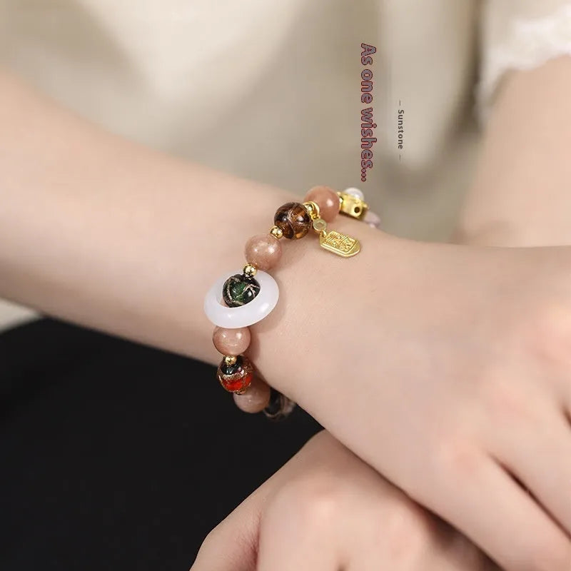 Hand-woven coloured glaze bracelet with Sunstone and white lip shell beads