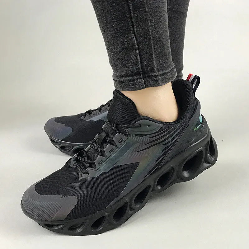 Men's low-top casual mesh trainers in black with lace-up front and round toe on a white background.
