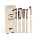 MAANGE five-piece apricot coloured makeup brush set with angled blush brush on a flat surface