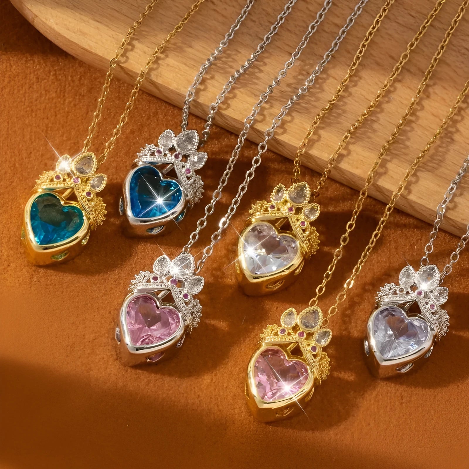 Crown and heart shaped zircon pendant necklace in Blue Gold on adjustable copper O-ring chain