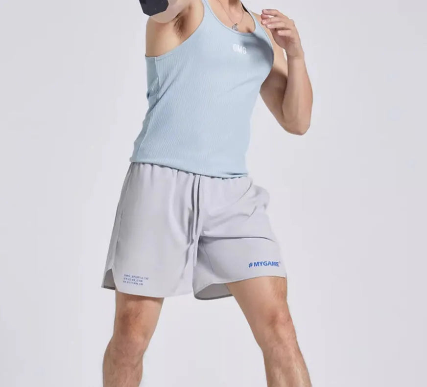Men's navy blue training shorts with moisture-wicking fabric on a grey background.