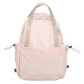 Simple solid colour nylon backpack in black on a neutral background, showing curved shoulder straps and top lock.