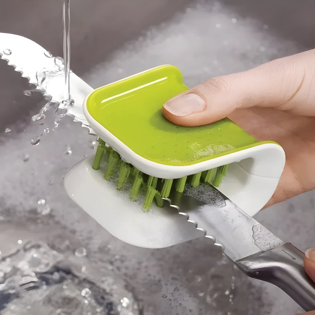 Blue U-shaped plastic brush for cleaning knives and forks in kitchen sink