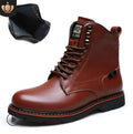 Men's brown embossed leather Martin boots with mid-top cut, round toe, thick heel, and front strap on a wooden floor