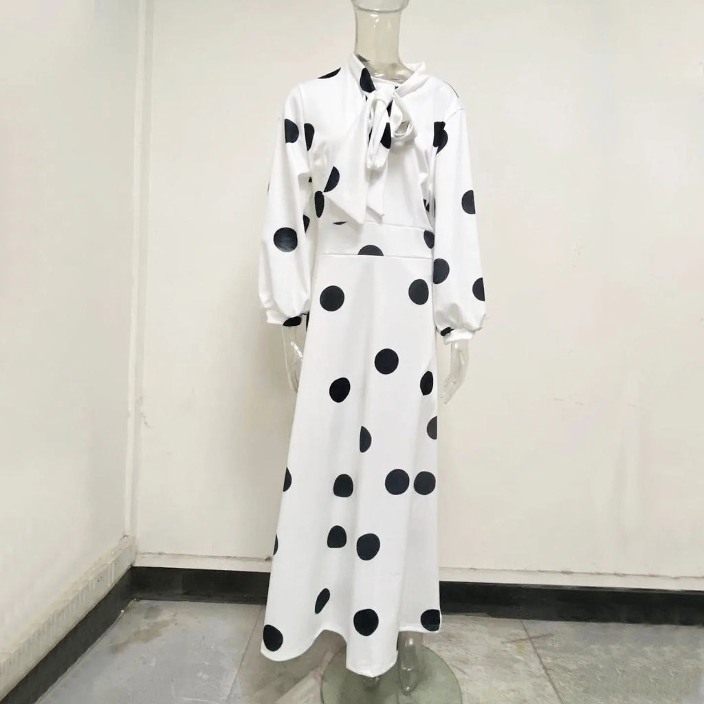 Women's large size white polka dot dress with long sleeves and long skirt, front view