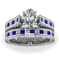 Blue alloy couple ring set with white diamond-style detail on white background