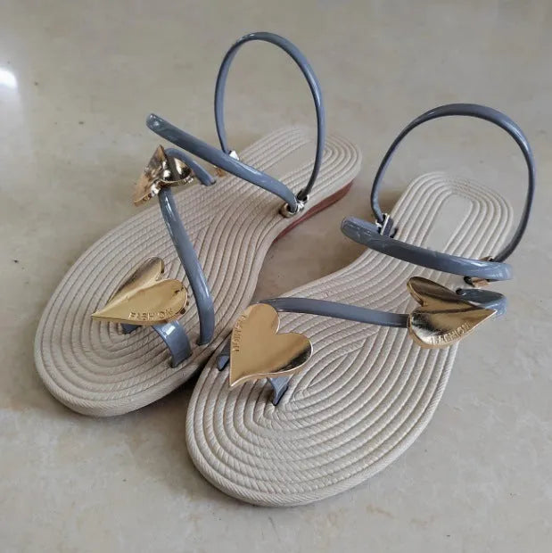 Women's flat sandals with decorative bow detail in white, made from PU and EVA material