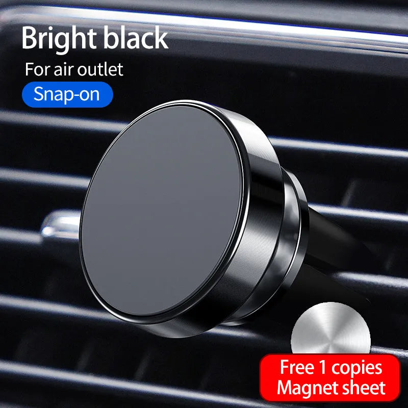 Black magnetic car phone holder attached to a car air vent, holding a smartphone at an angle.