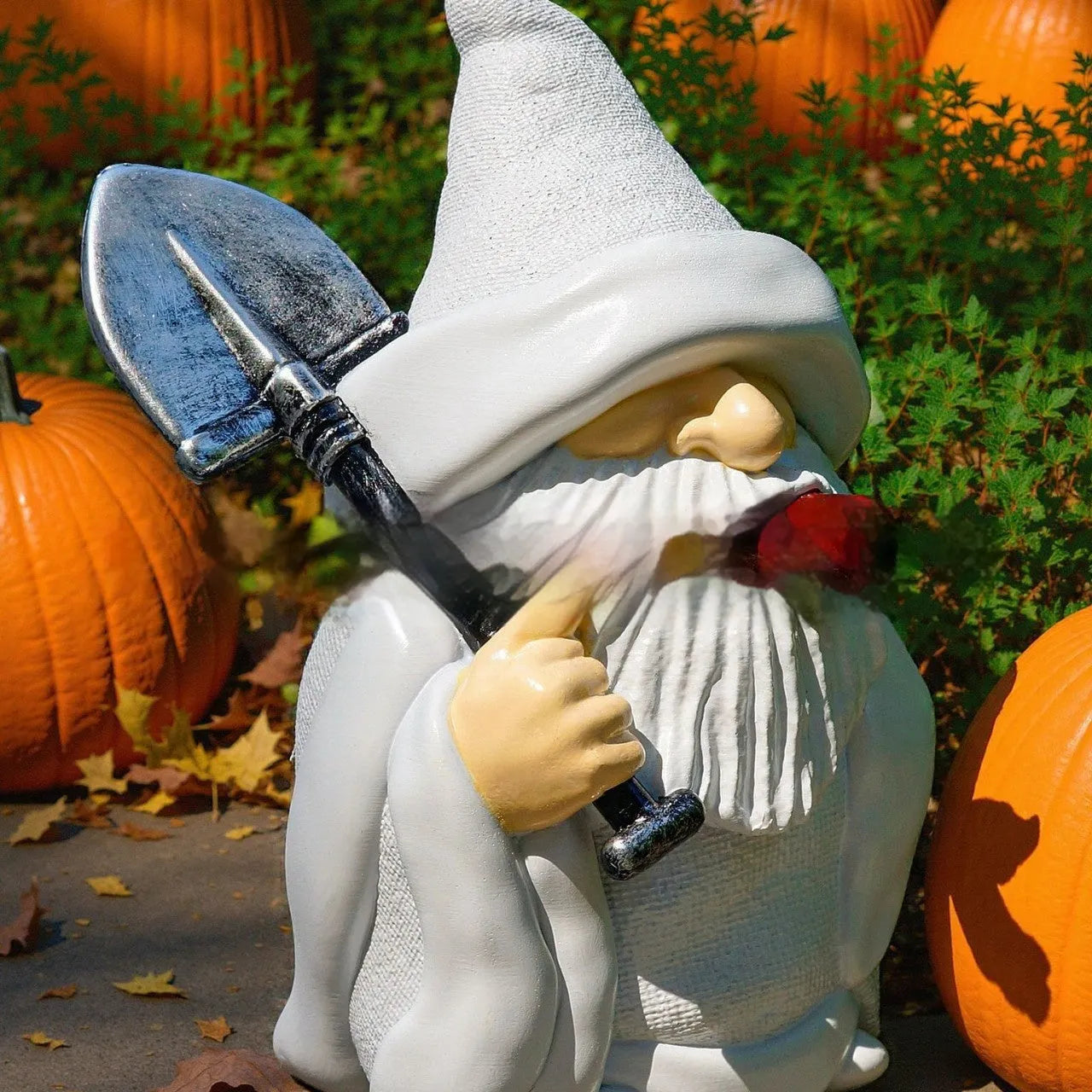 Christmas garden ornament showing dwarf character holding smoking shovel, resin craft figurine