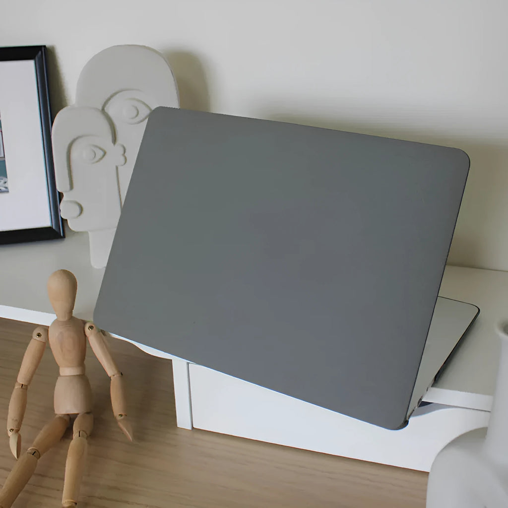 Quicksand Cobalt Gray polycarbonate protective shell for MacBook laptop on a desk