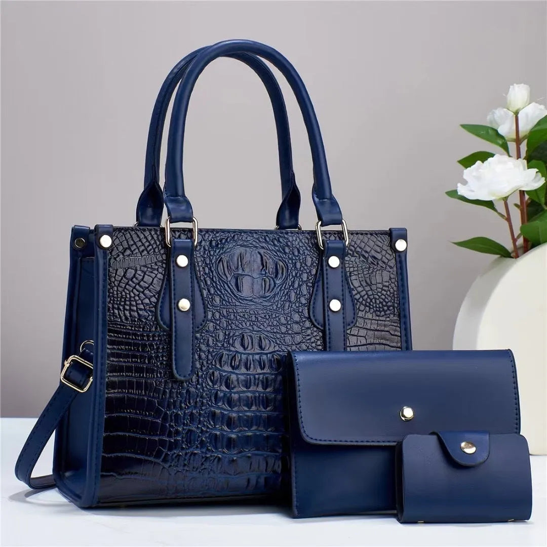 Contrast colour minimalist textured three-piece set showing crossbody bag, wallet, and card holder in burgundy.