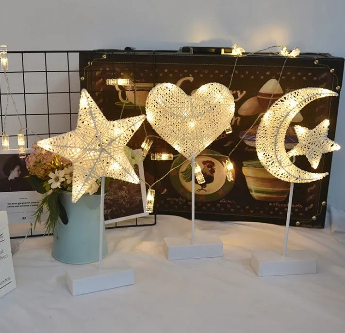 Rattan and copper wire LED table lamp in star, heart, or moon shape for bedroom decoration.