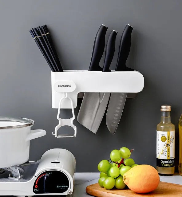White plastic kitchen knife rack with modern simple design placed on countertop
