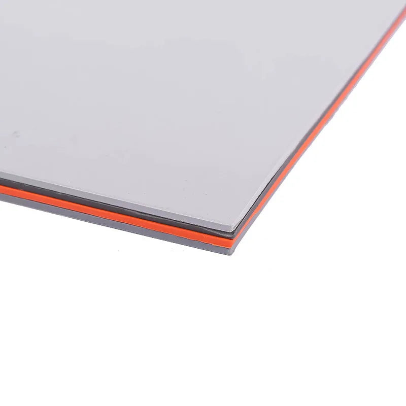Dark and light gray 23mm thick A4 laser engraving pad on a workbench