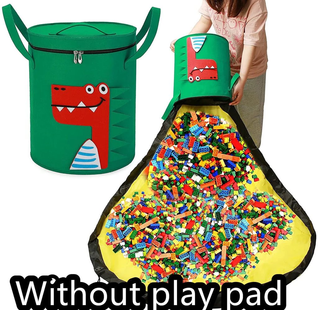 Green felt cube storage bag with pull rope, laid flat as a play mat next to toys.