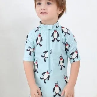 Boys' penguin print two-piece swim set with long sleeve rash guard top and matching swimming cap