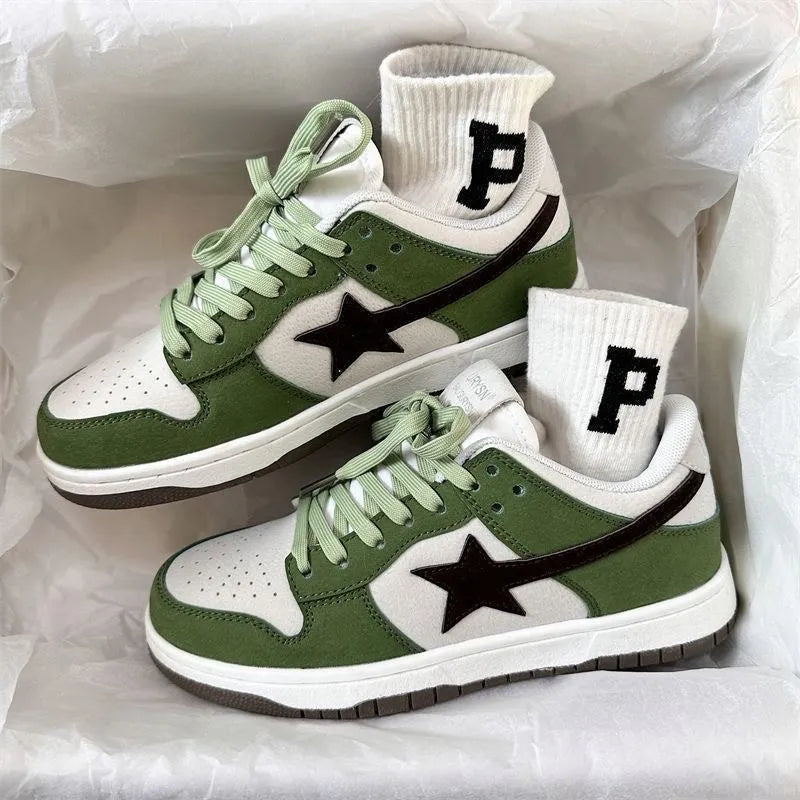 Retro style women's board shoes in green with lace-up closure and flat rubber sole