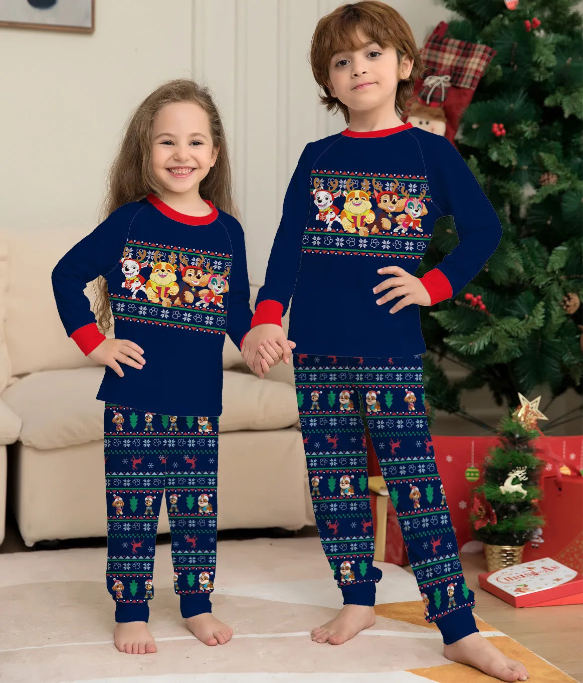 Red plaid family pyjamas set with cartoon deer print for adults, children, baby, and dog.