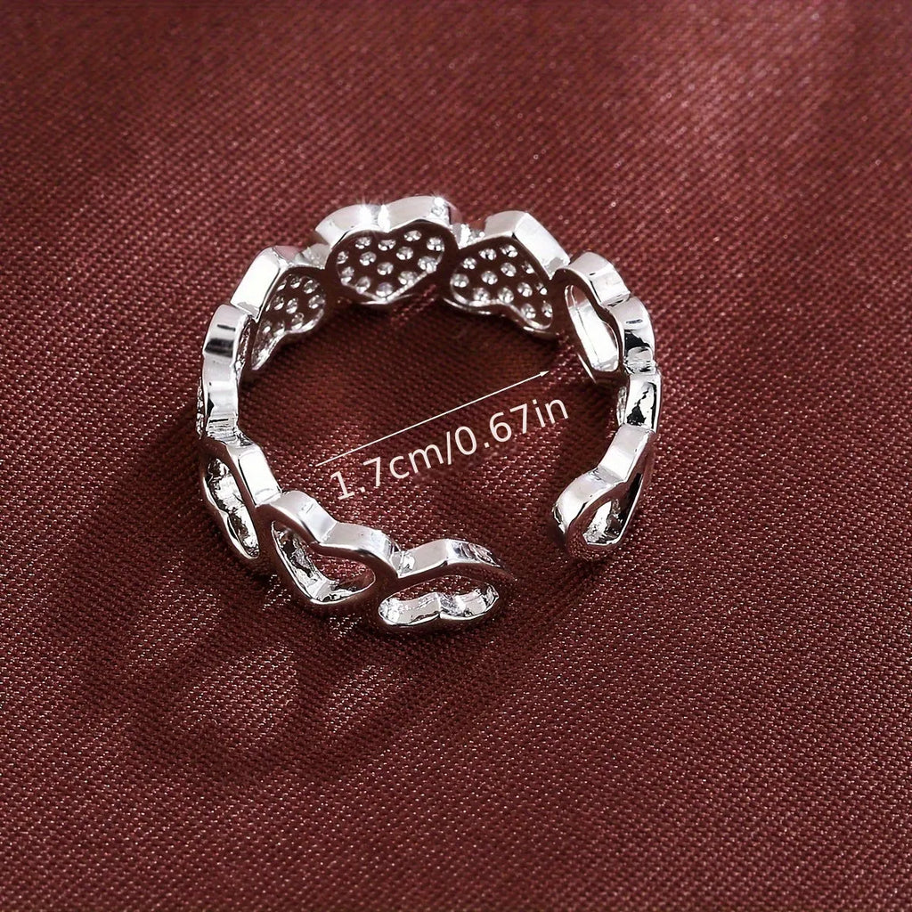 Geometric adjustable couples ring with a love heart design in gold or silver finish.