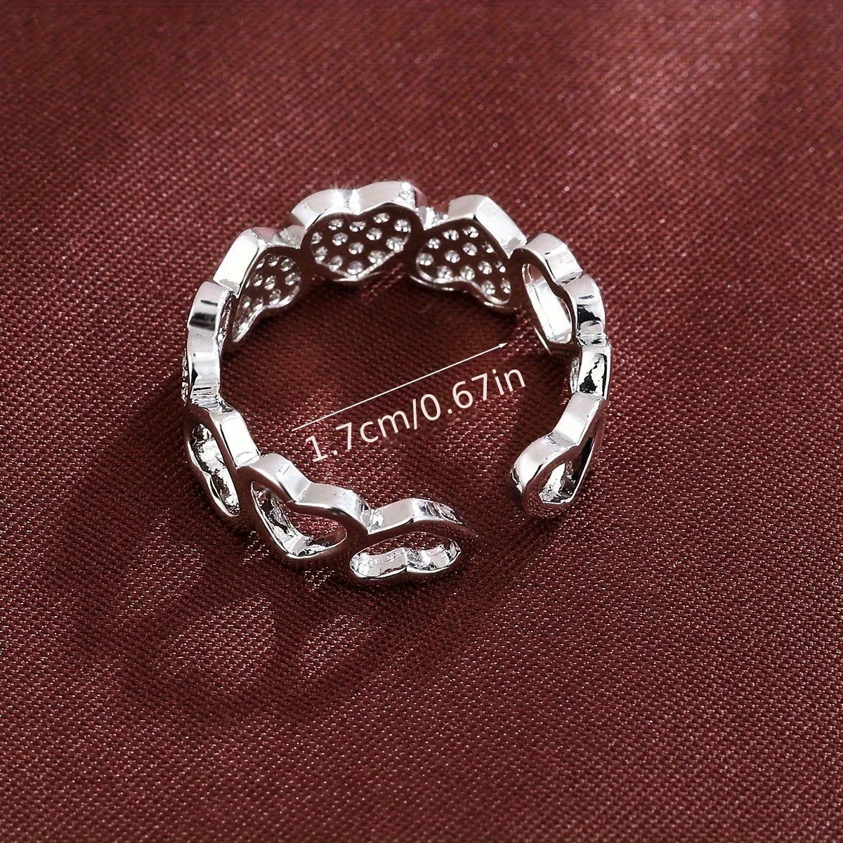 Geometric adjustable couples ring with a love heart design in gold or silver finish.