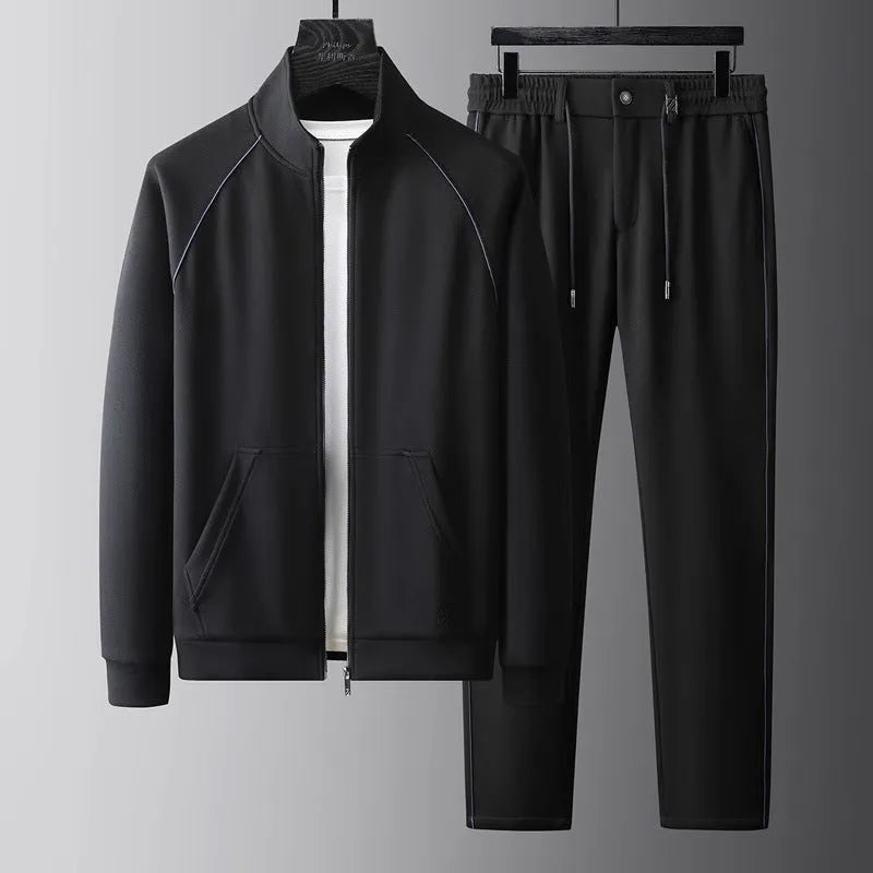 Men's slim fit stand collar tracksuit set in Vinylon fabric shown in black colour.