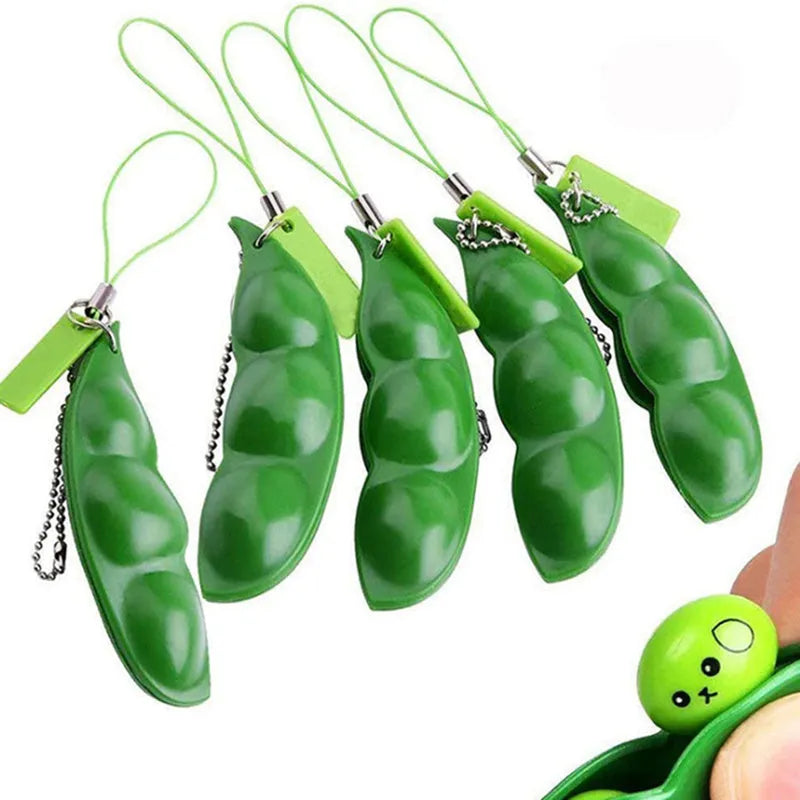Green PU squeeze toy shaped like a bean pod, used as a pendant for stress relief