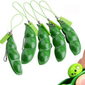 Green PU squeeze toy shaped like a bean pod, used as a pendant for stress relief