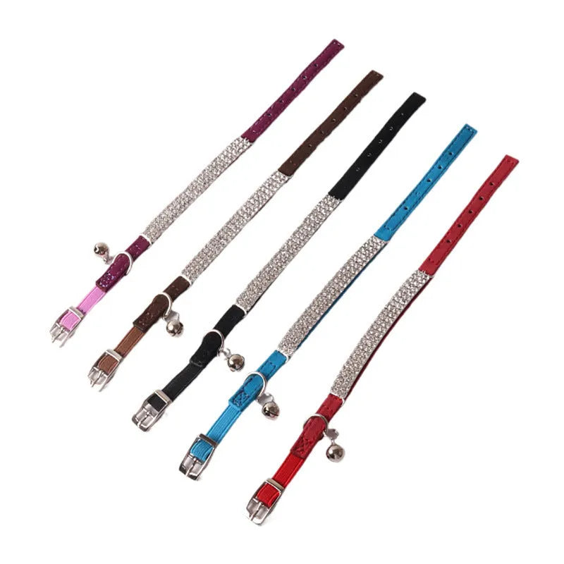 Soft flocked cat collar with elastic buckle in multiple colours on a white background.