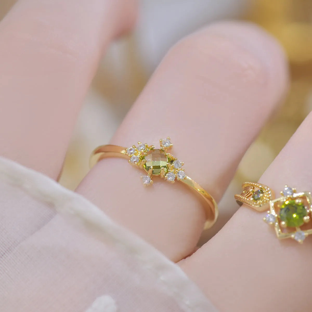 Open mouth geometric ring with round zircon stones on copper band, available in purple or olive green