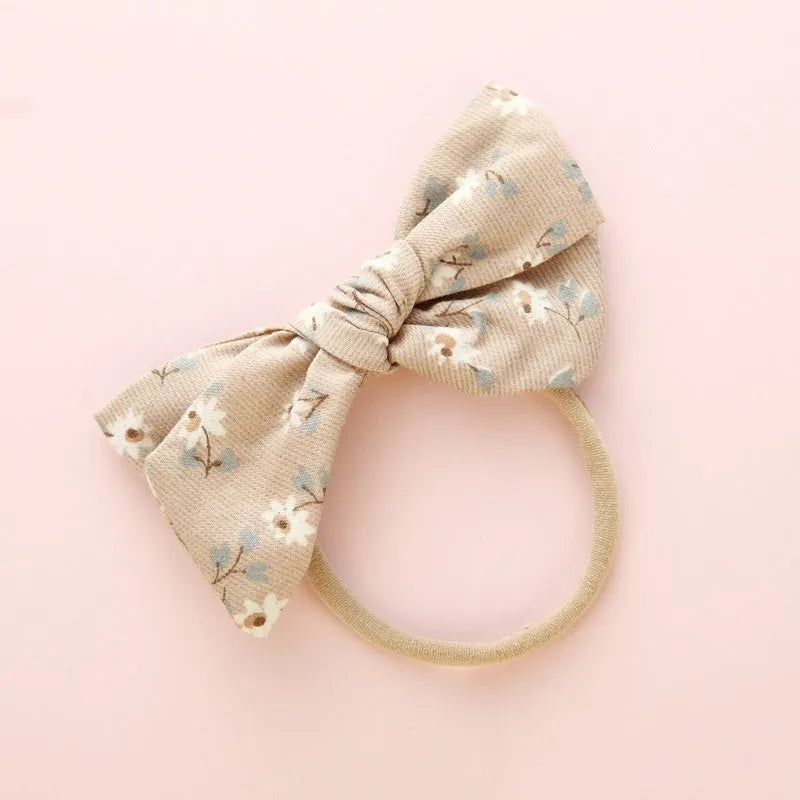 Children's knotted bow hair ring in cloth fabric with printed princess series design