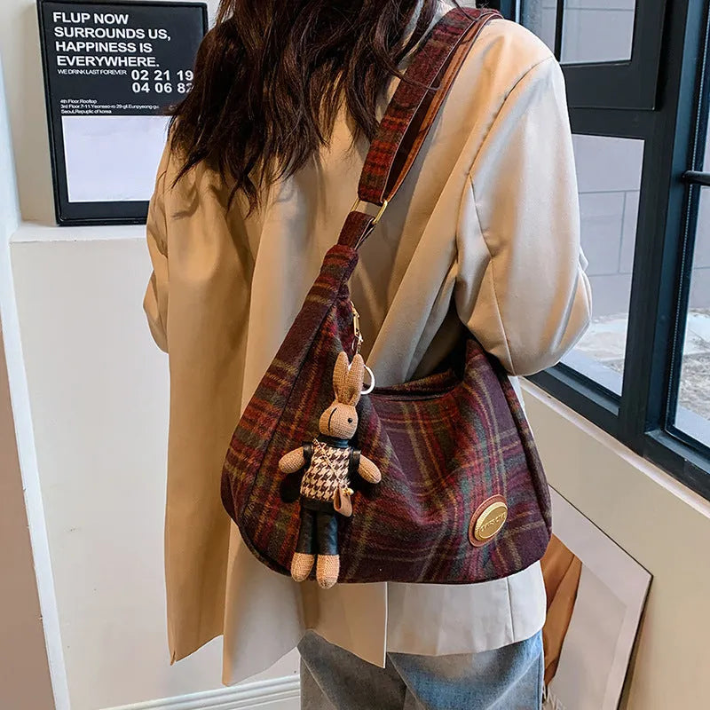 Women's large soft woolen cross-body shoulder bag in a horizontal square shape, shown in a choice of colours.