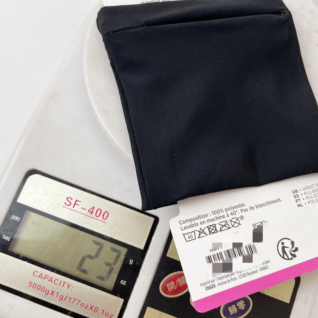 Compact black wrist bag armband sleeve for phone, shown with OPP packaging, dimensions 10cm by 10.5cm.