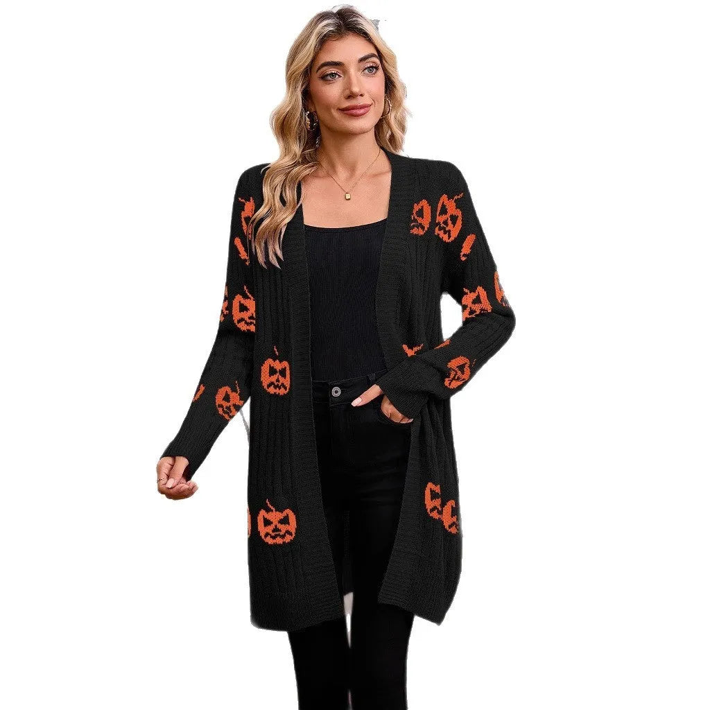 Women's black cardigan with orange knitted pumpkin head jacquard pattern.