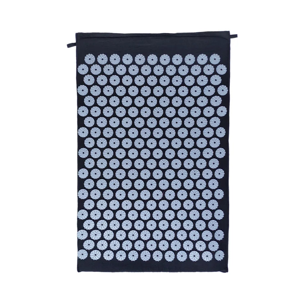Acupuncture massage mat yoga mat set with black and blue cushion and headrest on floor