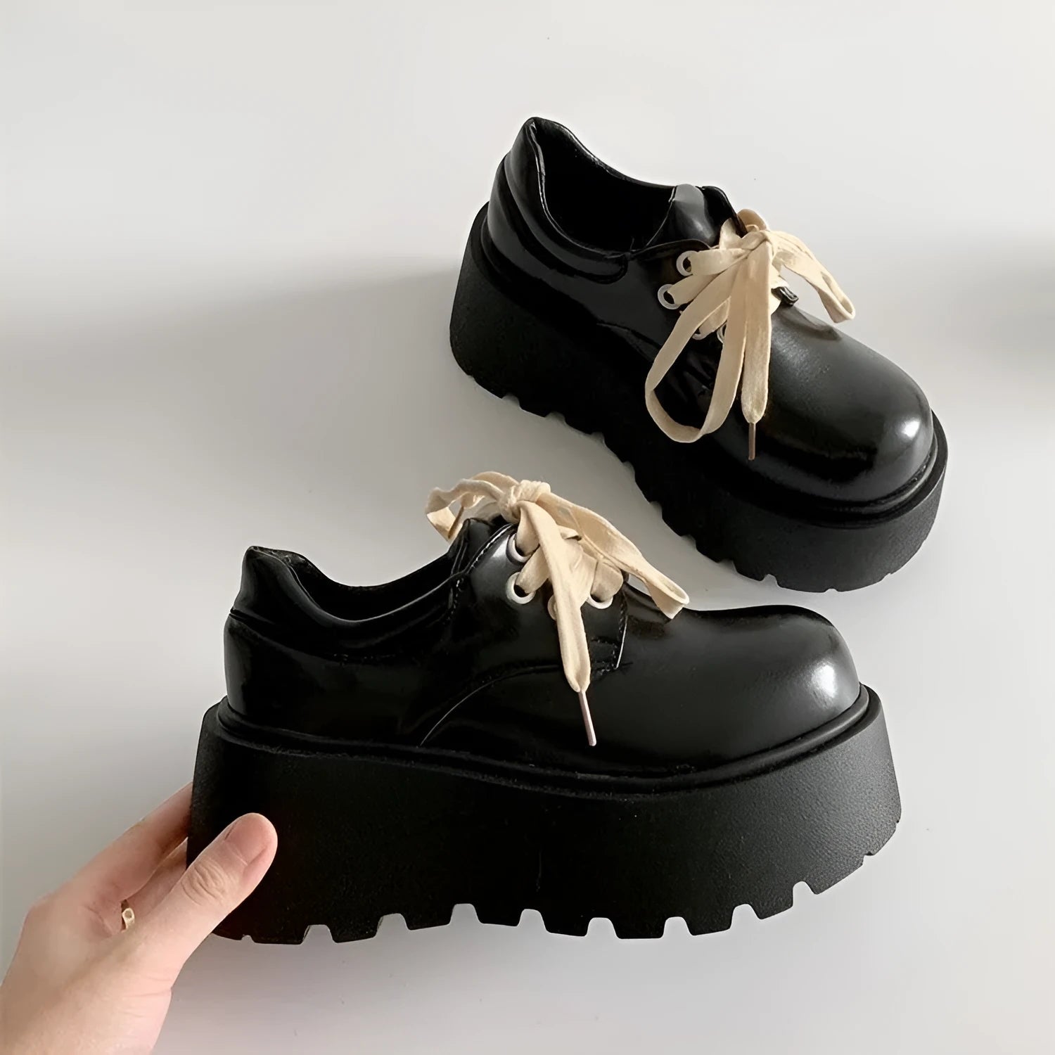 Matte black women's lace-up shoes with a chunky 6-8cm heel and round toe on a white background.