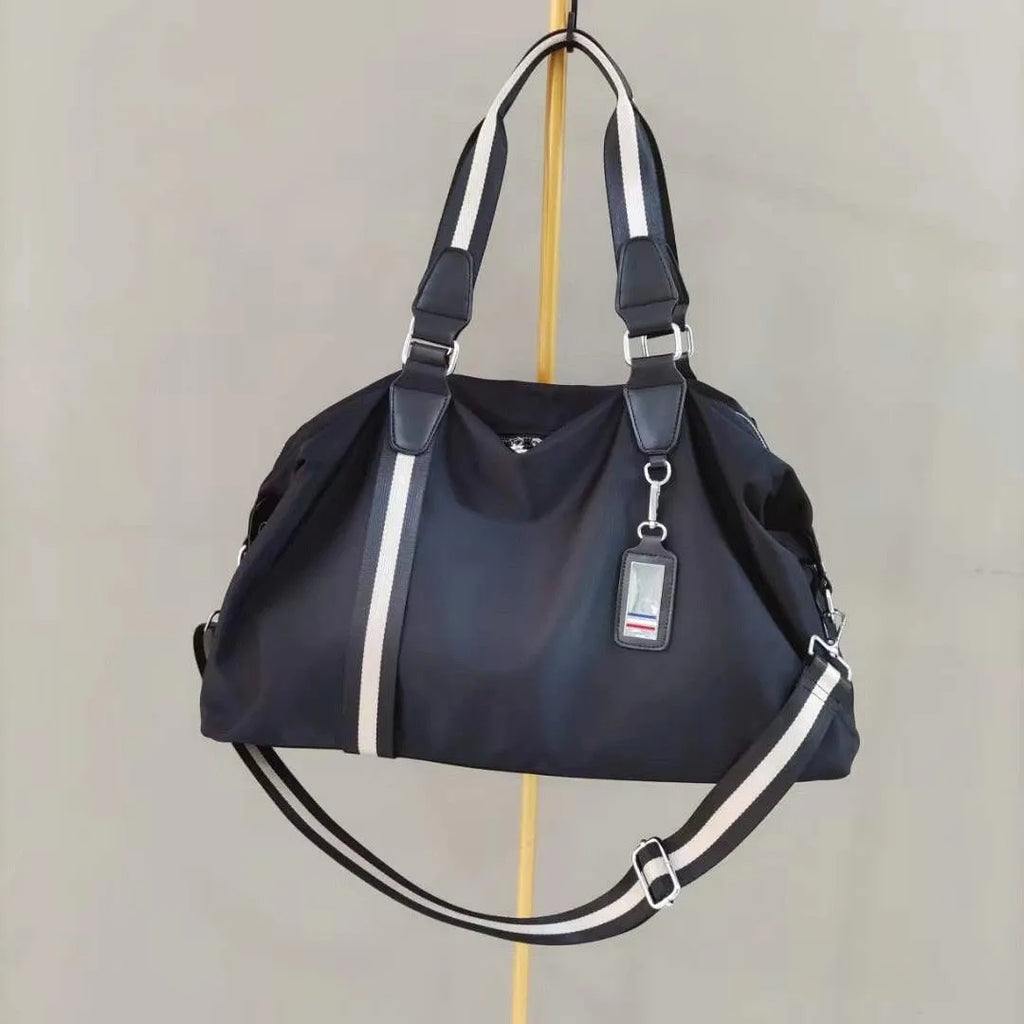 Portable Oxford cloth travel bag for men with black gold colour and multiple internal pockets