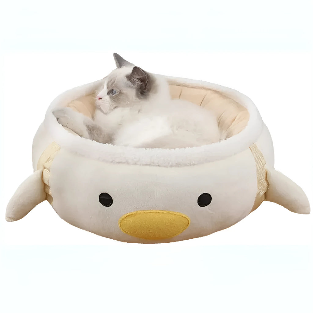 Green dinosaur and chick shaped cat bed shown both flat and hanging as a hammock for small pets.