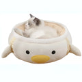 Green dinosaur and chick shaped cat bed shown both flat and hanging as a hammock for small pets.