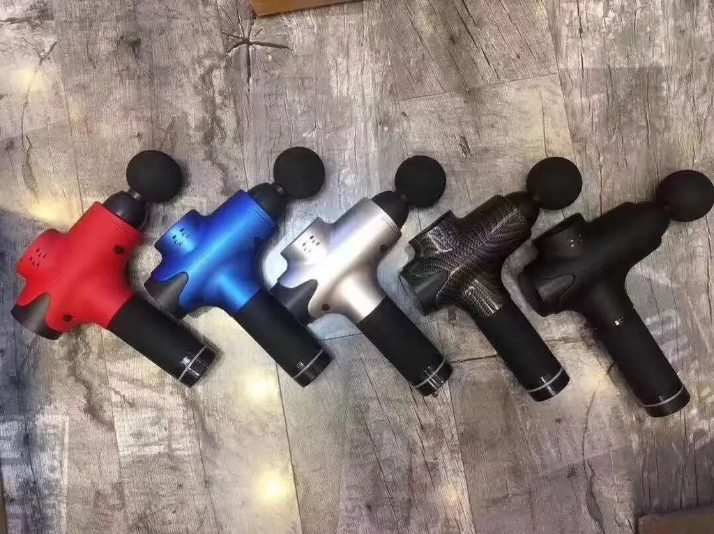 Massage gun with 6 massage heads, black ABS body, and LCD touch screen on a white background